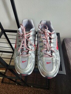 Nike Silver Sneakers with Red Accents
